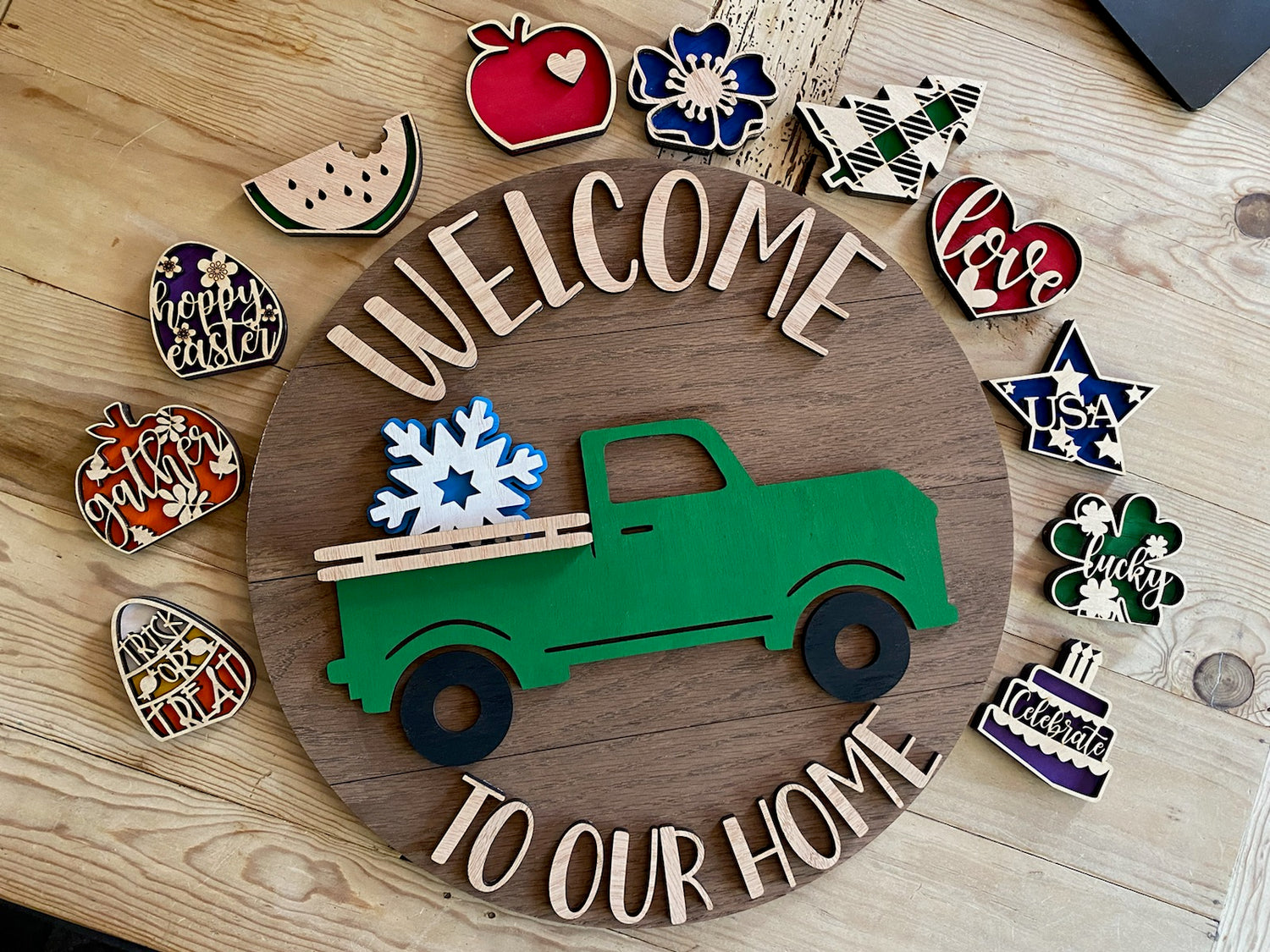 Round welcome to our home sign with old truck and interchangeable season/holiday items